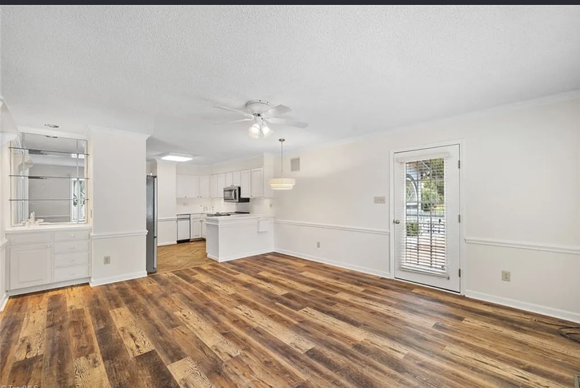Open kitchen and dining area with fresh paint and LVP flooring