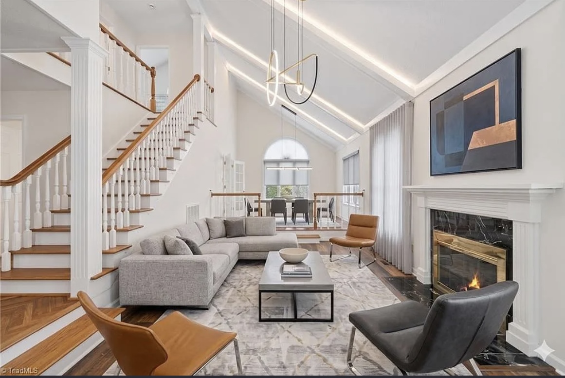 Freshly painted vaulted living room with fireplace in Charlotte, NC